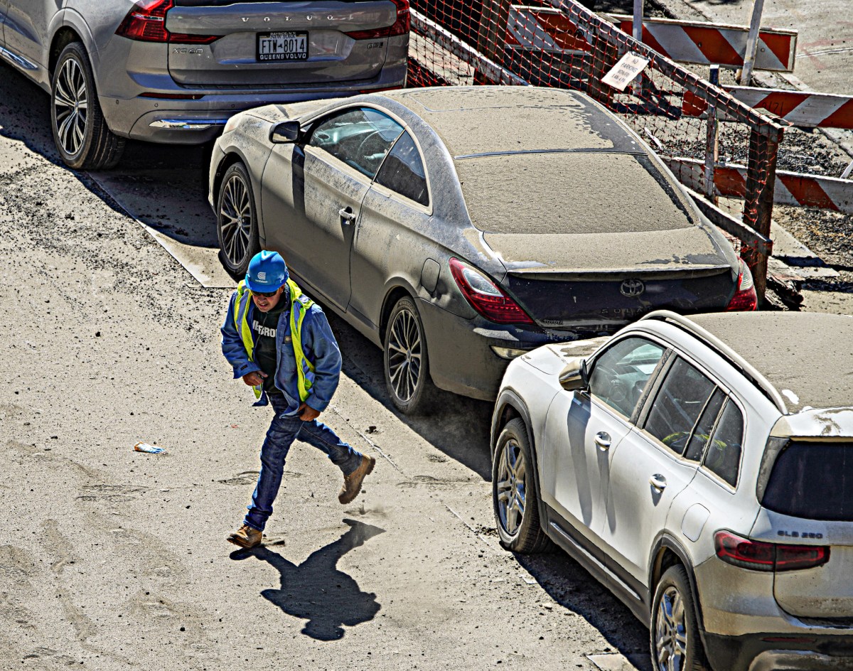 A Con Edison worker runs from the gas.