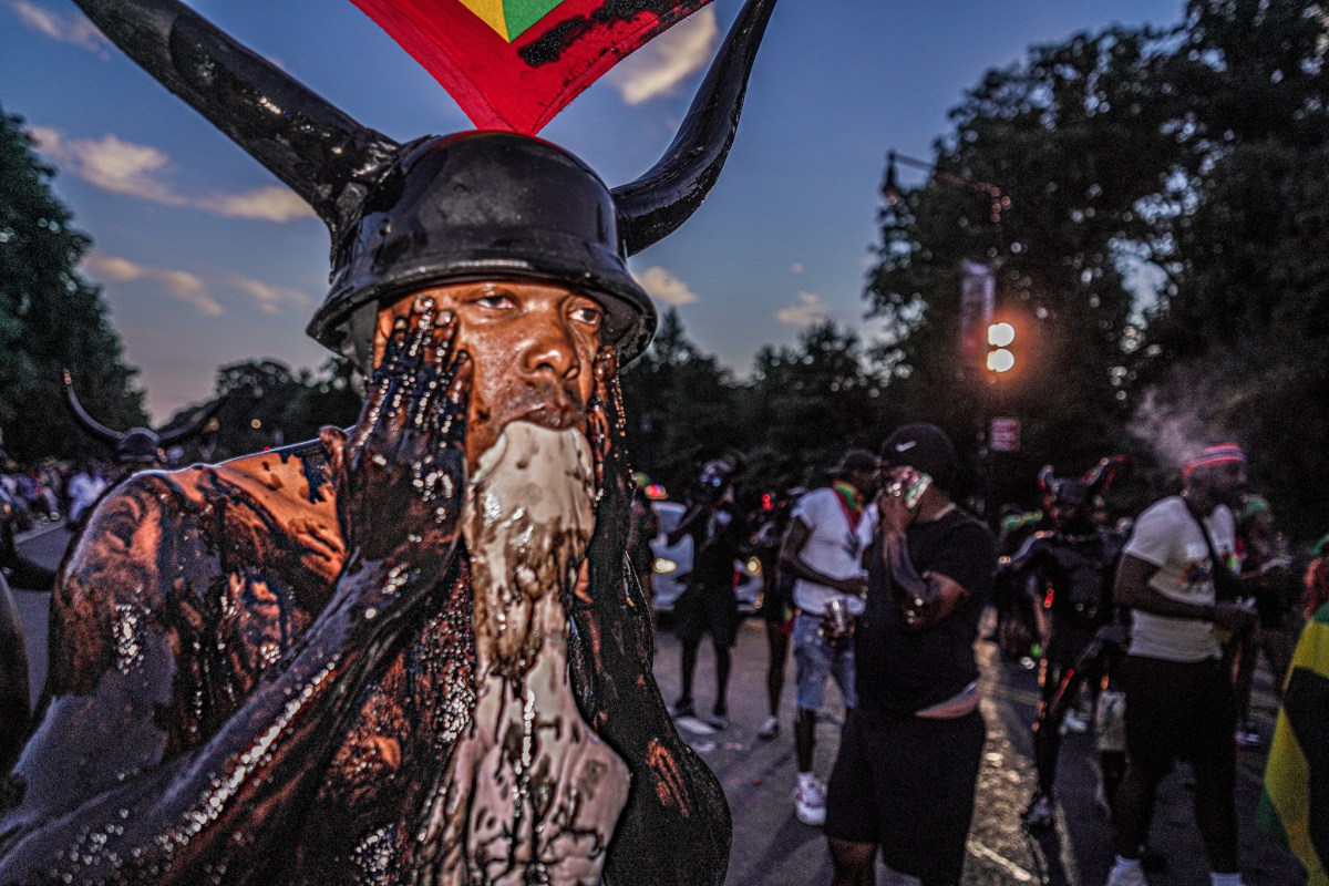 J'ouvert reveler in Brooklyn wearing horns