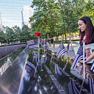 Woman at 9/11 memorial pauses to reflect on anniversary of terrorist attacks