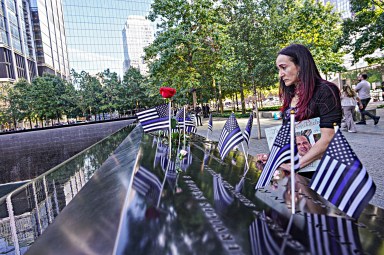 Woman at 9/11 memorial pauses to reflect on anniversary of terrorist attacks