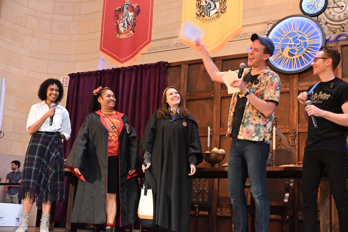 Steve Haggard, Daniel Frederick, and Cara Ricketts, who play Harry, Ron and Hermione, respectfully, in "Harry Potter and the Cursed Child," with two fans.