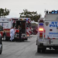 Paramedics tend to a fisherman who rescued a man from the Canarsie Pier.