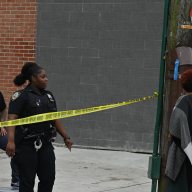 FILE - Police at a Brooklyn shooting scene