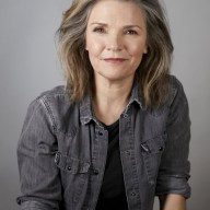 actress Kathryn Erbe wearing a gray-blue shirt