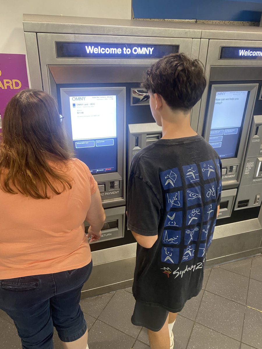 People using OMNY vending machine