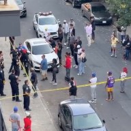 Brooklyn police and crowd outside location where cops shot man dead