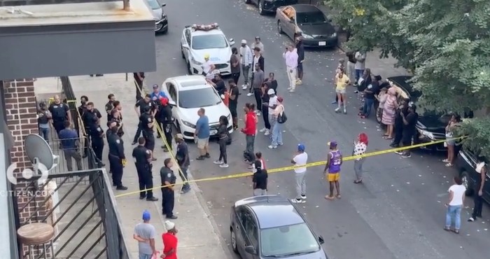 Brooklyn police and crowd outside location where cops shot man dead