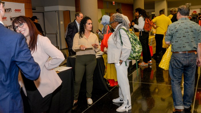 group of people inside a college attending a financial forum