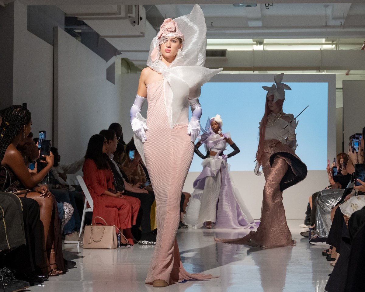 Models strut down the catwalk showcasing the collection by fashion designer Alexander King Chen. 