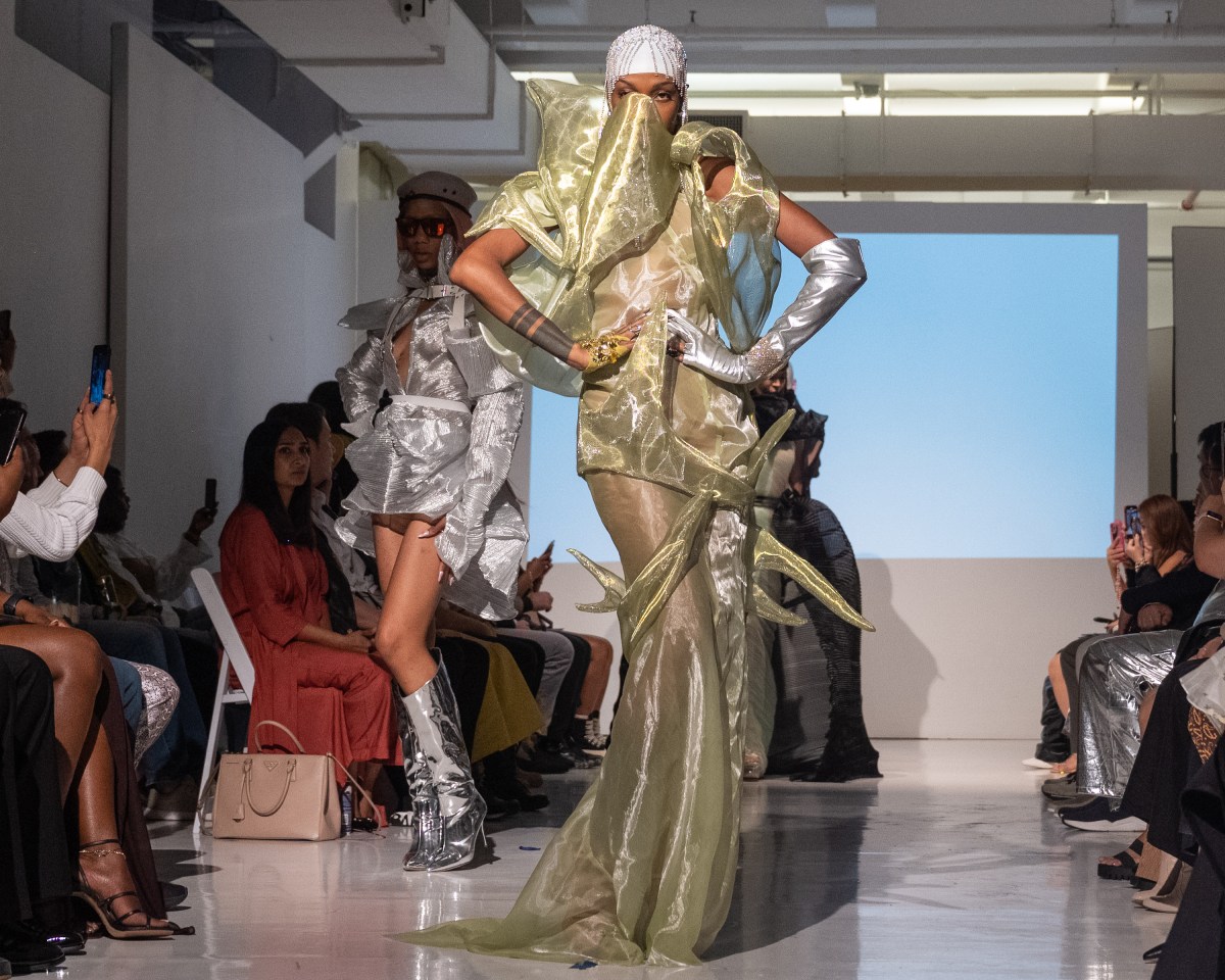 Models strut down the catwalk showcasing the collection by fashion designer Alexander King Chen. 