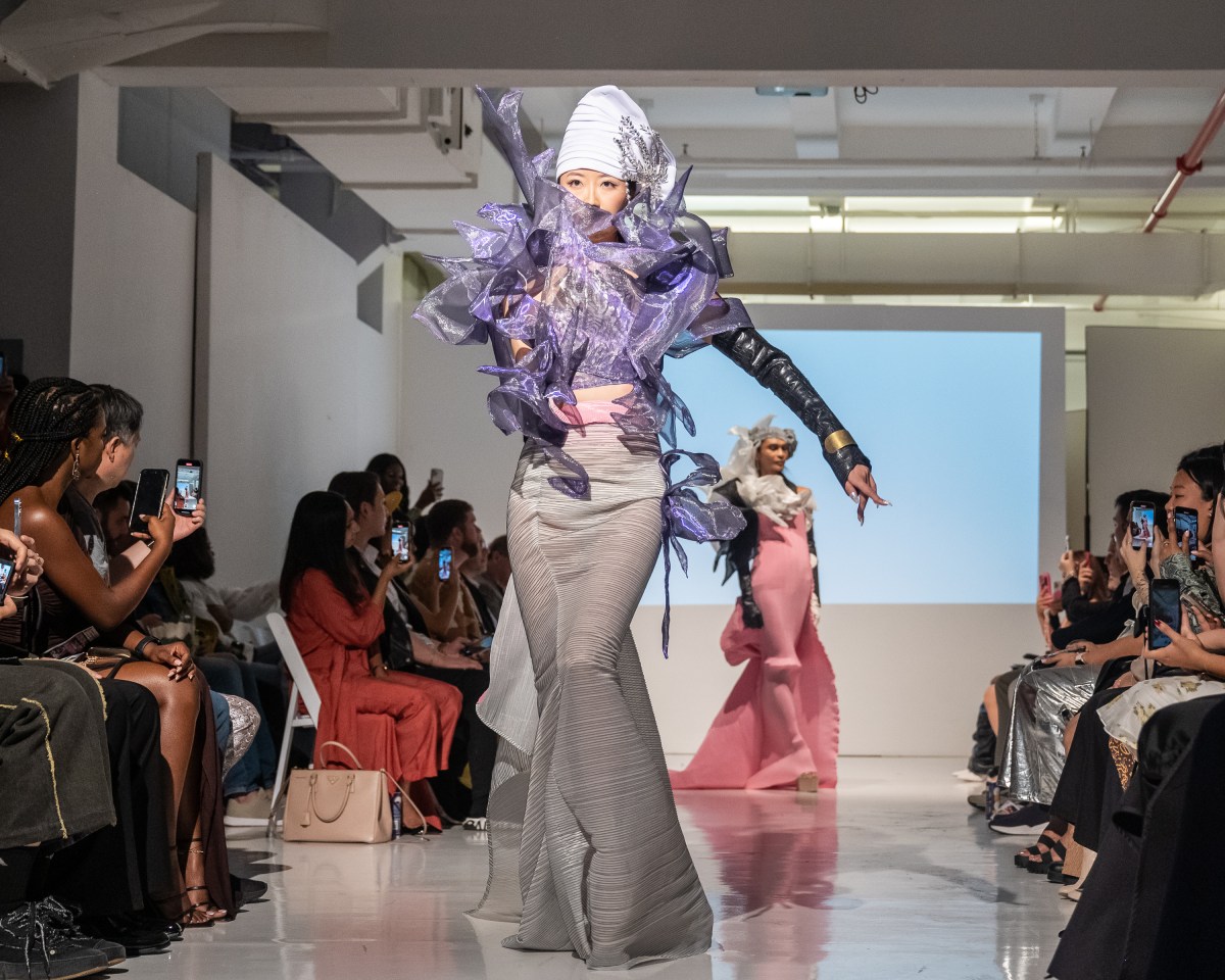 Models strut down the catwalk showcasing the collection by fashion designer Alexander King Chen. 