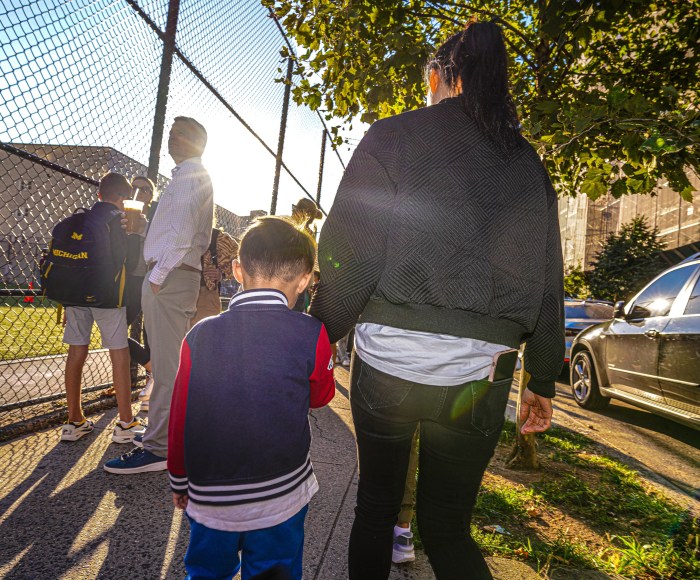 students wait with their parents outside a NYC school