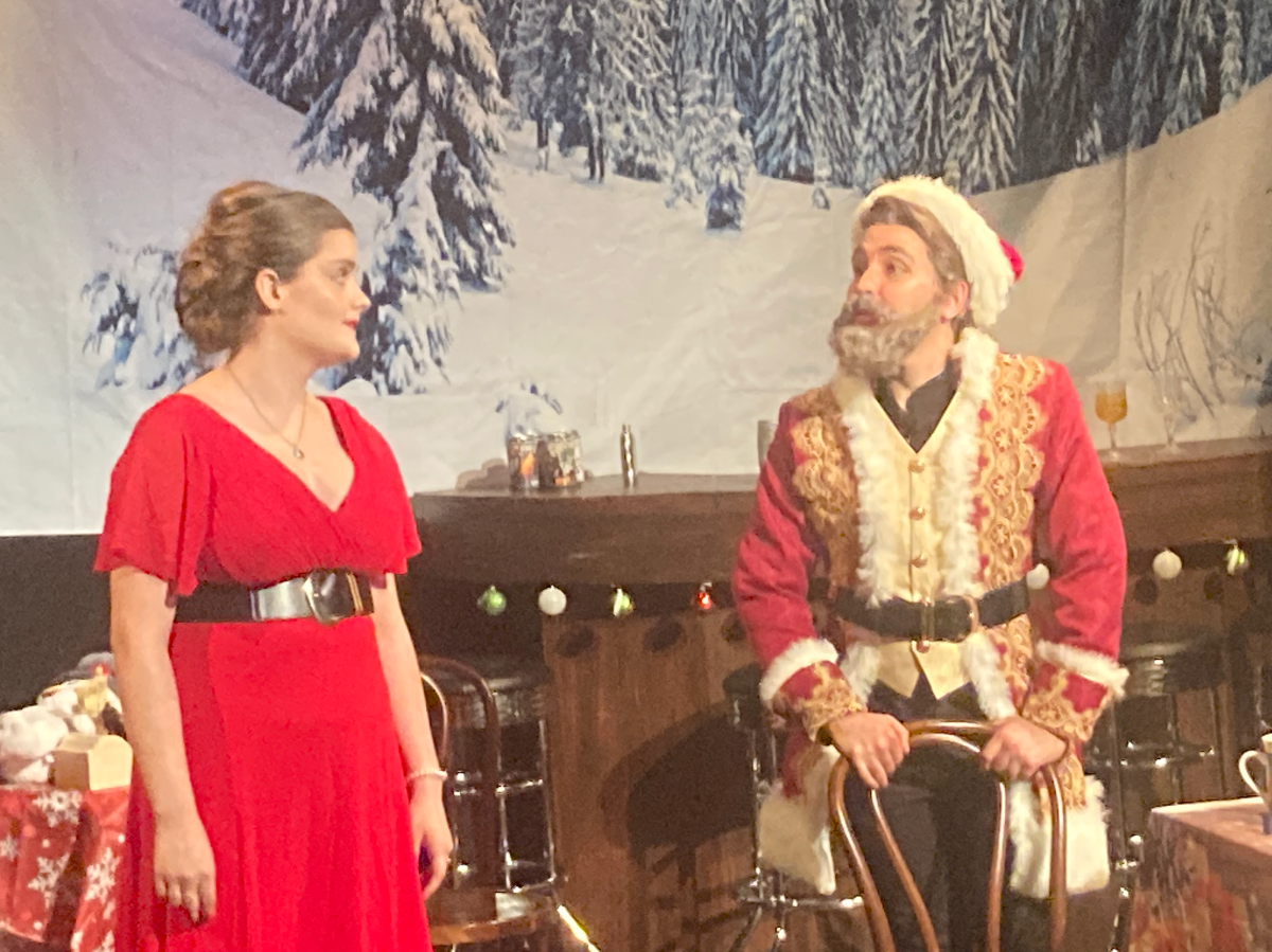 scene from the Christmas Express, a NYC holiday show, showing Santa and Mrs. Claus