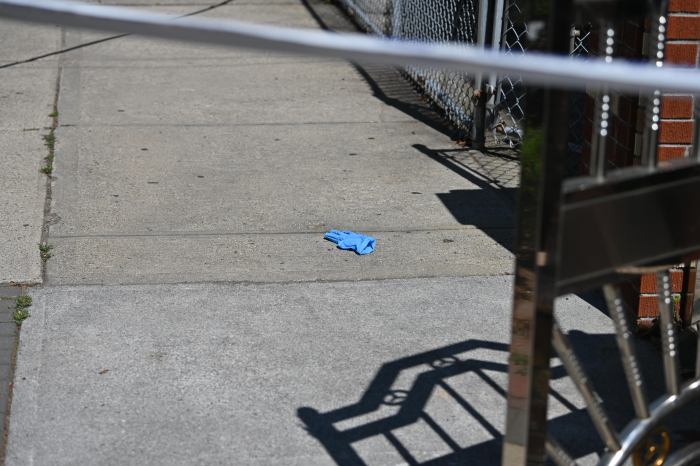 plastic glove on a sidewalk in Brooklyn