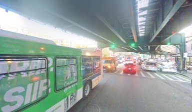 busy street with traffic in Inwood, Manhattan