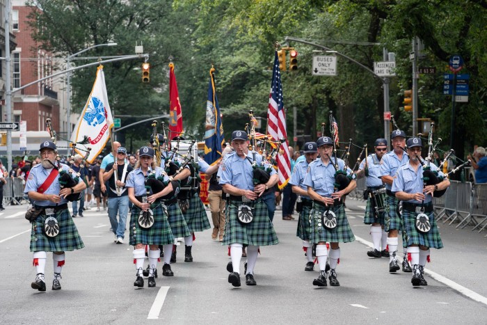 bagpipers wearing kilts performing in Labor Day Parade