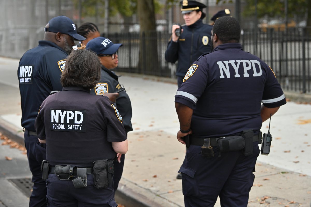 police in uniform investigating a scene in Canarsie, Brooklyn