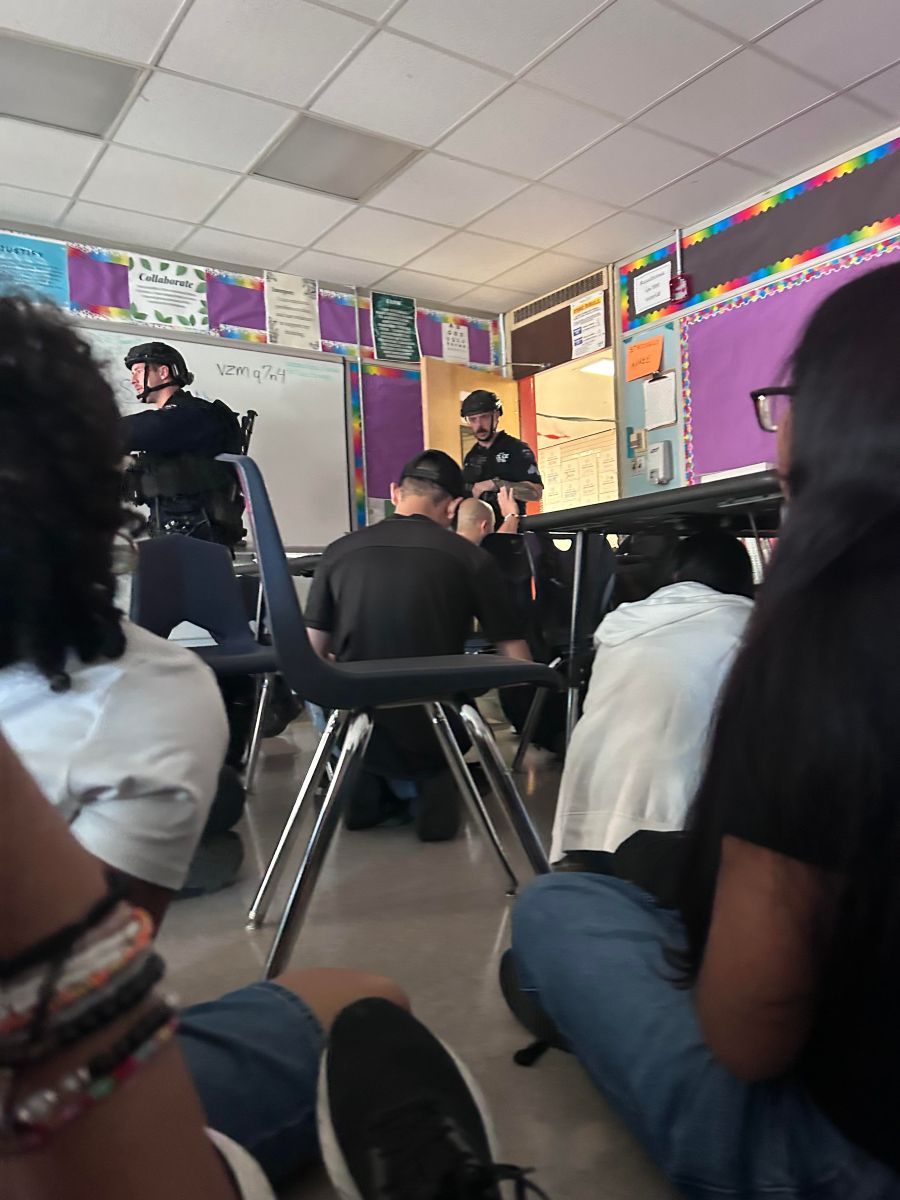 NYPD officers look for a reported shooter inside a classroom on lockdown inside Louis Brandeis High School on the Upper West Side