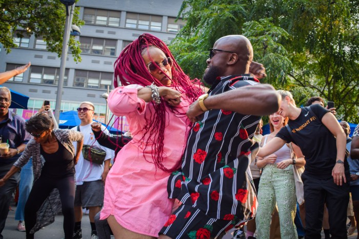 people celebrating outdoors at an event for New York voter registration 