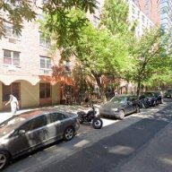 Hell's Kitchen street with parked cars