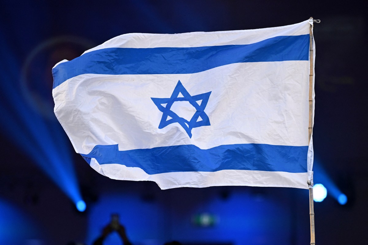 The flag of Israel is seen during a Jewish community vigil marking the first anniversary of Hamas’ October 7 attack on Israel in Moorabbin