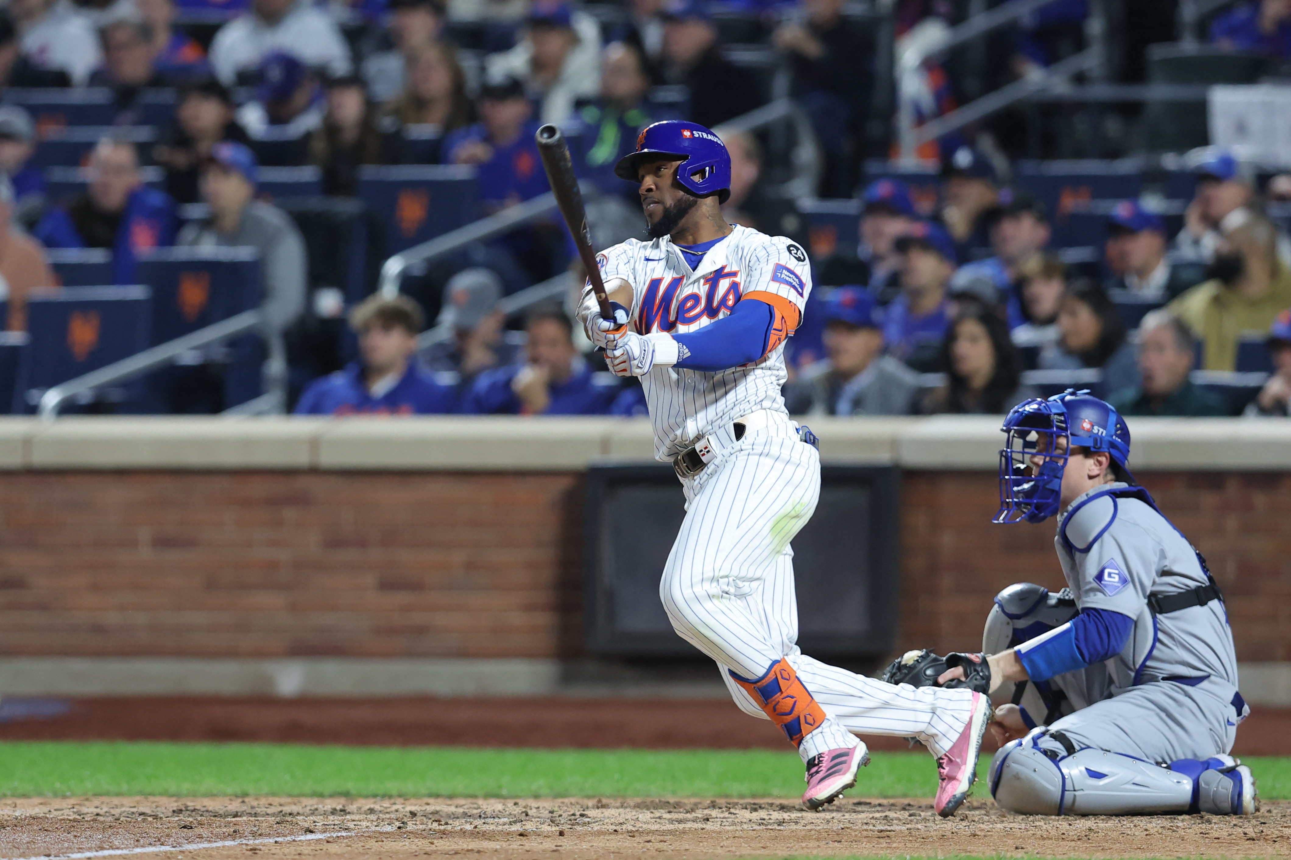 New York City, New York, USA; New York Mets outfielder Starling Marte (6) hits a double in the sixth inning against the Los Angeles Dodgers during game five of the NLCS for the 2024 MLB playoffs at Citi Field. Mandatory Credit: Brad Penner-Imagn Images