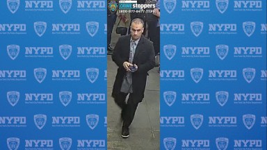 man in a long dark coat who allegedly abused a woman near Times Square