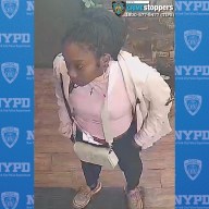 woman wearing white sweater wanted for random attack in Lower Manhattan