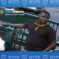 man wearing dark colored clothes wanted for allegedly taking part in a random attack in SoHo