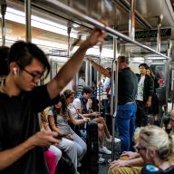 Subway riders on board a 7 train in Manhattan on Oct. 22, 2024.