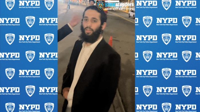 man at night wearing a white shirt and black jacket who allegedly committed a hate crime in Brooklyn 