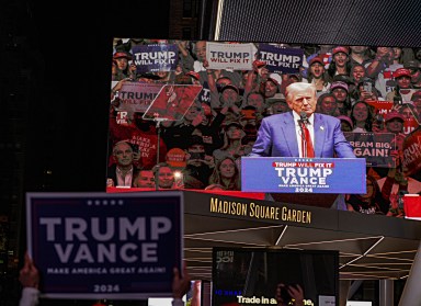 People outside Madison Square Garden watching Donald Trump, the former president, speak during his rally at the arena on Oct. 27, 2024.