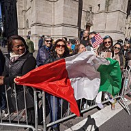 people holding Italian flag at Columbus Day Parade in NYC