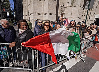 people holding Italian flag at Columbus Day Parade in NYC