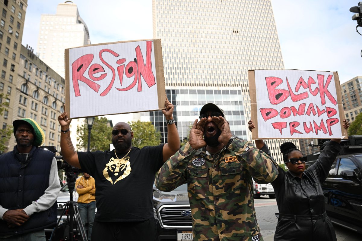 Protesters call for Mayor Eric Adams to resign.