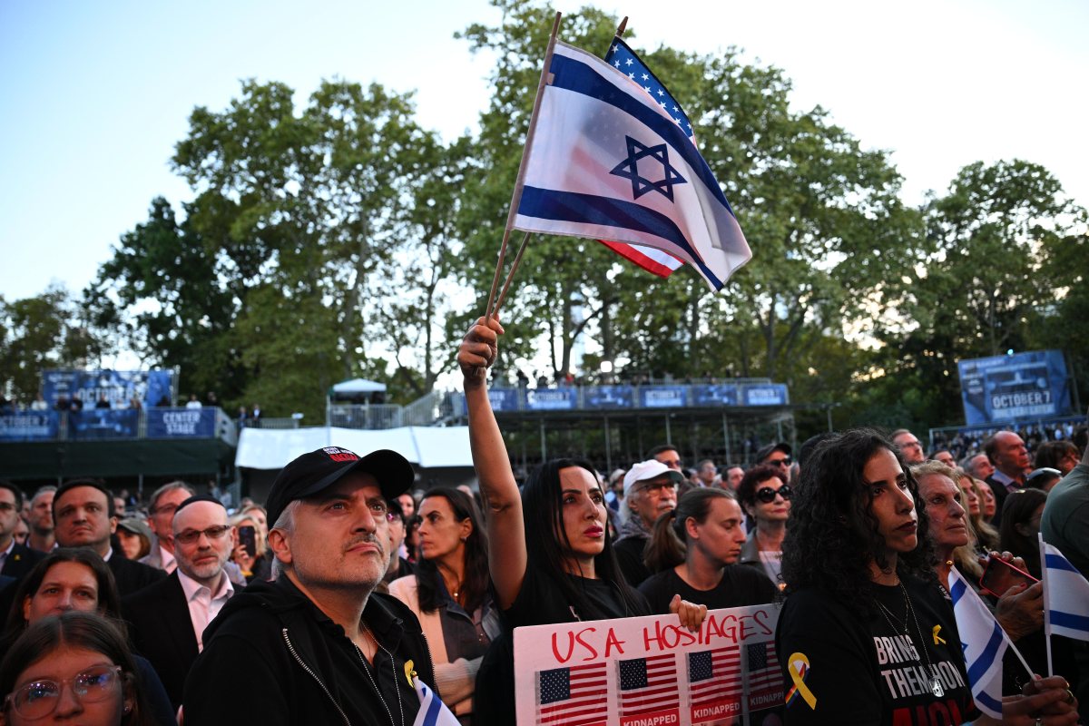 Person holds Israeli flag at Oct. 7 anniversary ceremony in Central Park