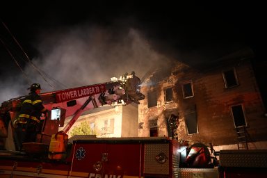 firefighters work on a fire at at Staten Island church