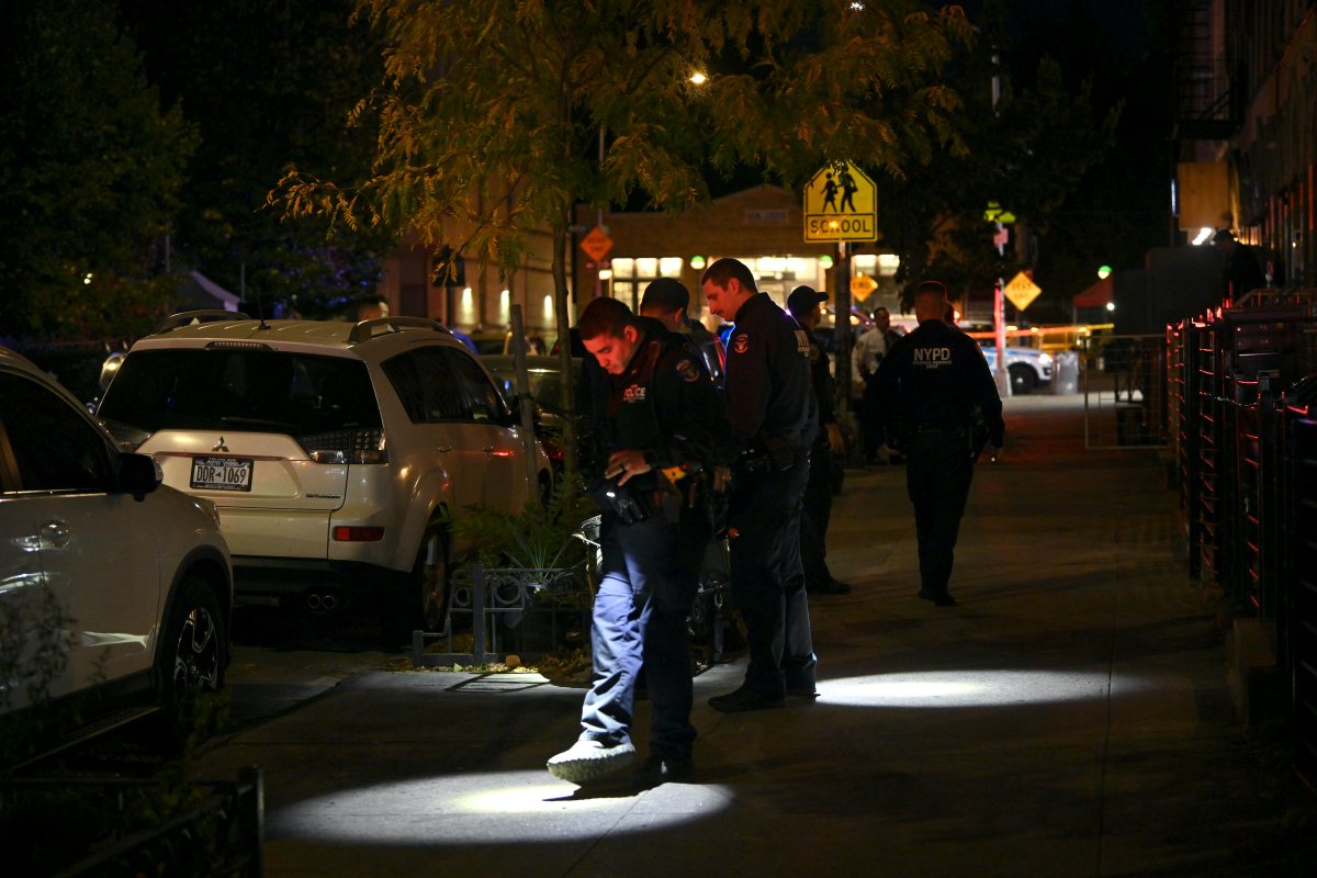 Officers look for evidence after a 15 year old male was shot at 634 Wilson Ave. in Brooklyn on Oct. 18, 2024.