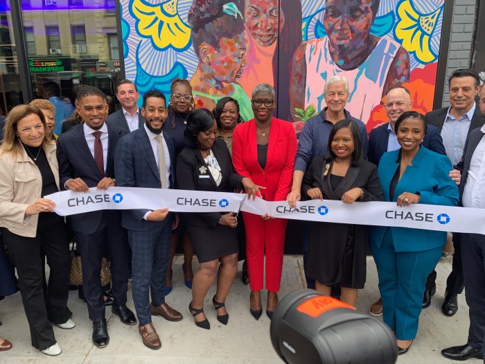 people cutting the ribbon for a new bank branch in Bed-Stay