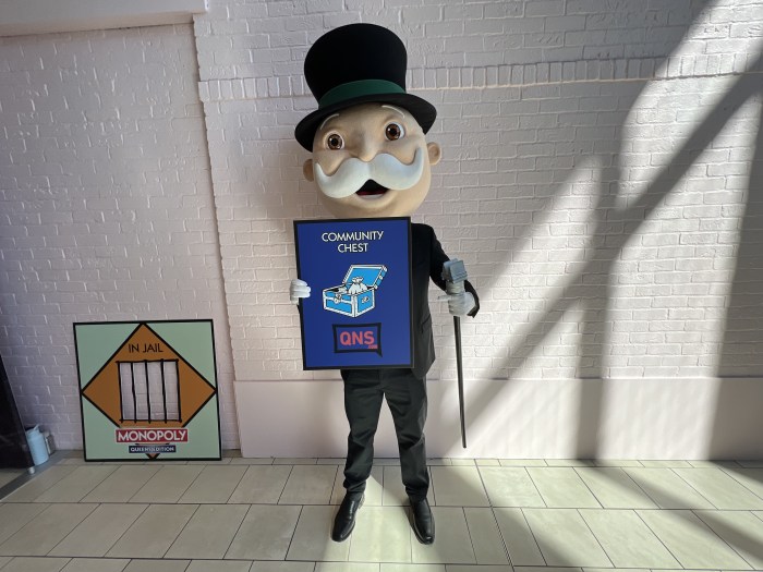 The Monopoly man holds the Queens edition of the day.