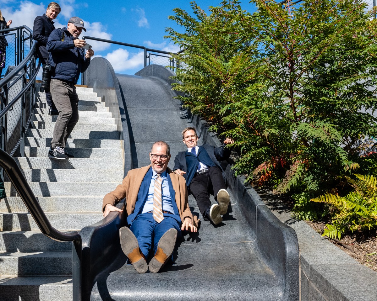 Manhattan Borough President Mark Levine and CM Erik Bottcher enjoy the granite slide. 