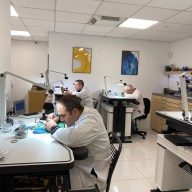 workers in a workshop that does watch repair in NYC