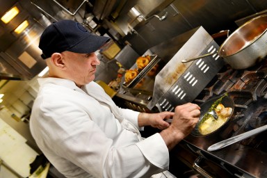 Le Coin head chef prepares scallop dish