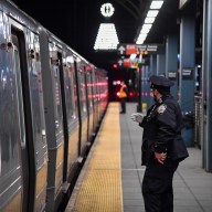 Police officer at Brooklyn subway station where deadly stabbing occurred