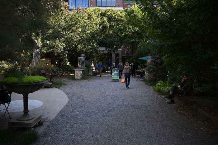 People walking through the Elizabeth Street Garden in SoHo