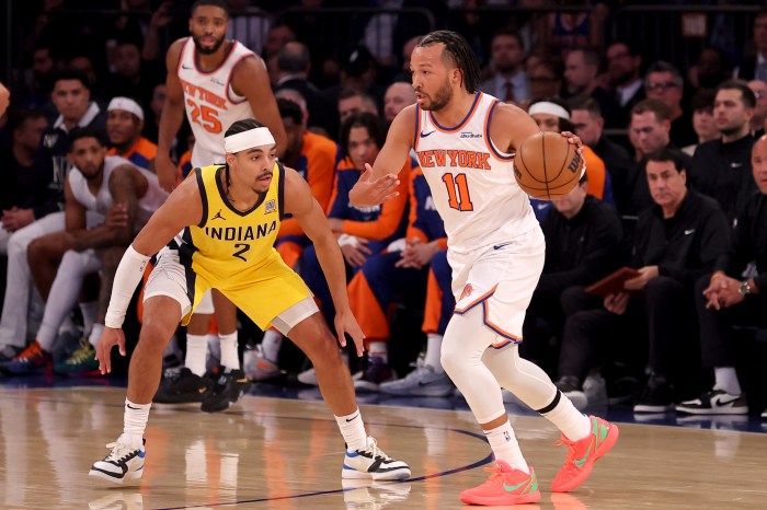 Oct 25, 2024; New York, New York, USA; New York Knicks guard Jalen Brunson (11) controls the ball against Indiana Pacers guard Andrew Nembhard (2) during the first quarter at Madison Square Garden