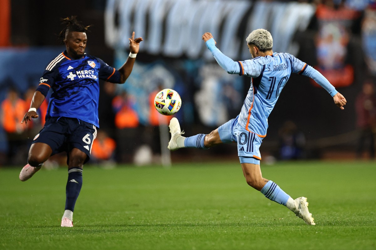 NYCFC player kicks ball