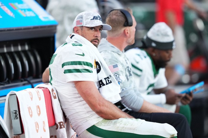 Jets quarterback Aaron Rodgers (8) looks on against the Arizona Cardinals during the second half at State Farm Stadium.