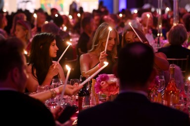 Guests light candles as Gabrielle's Angel Foundation hosts Angel Ball 2024 at Cipriani Wall Street on October 28, 2024 in New York City.