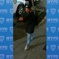 suspect wearing dark clothes who allegedly robbed a woman in Hell's Kitchen in Manhattan